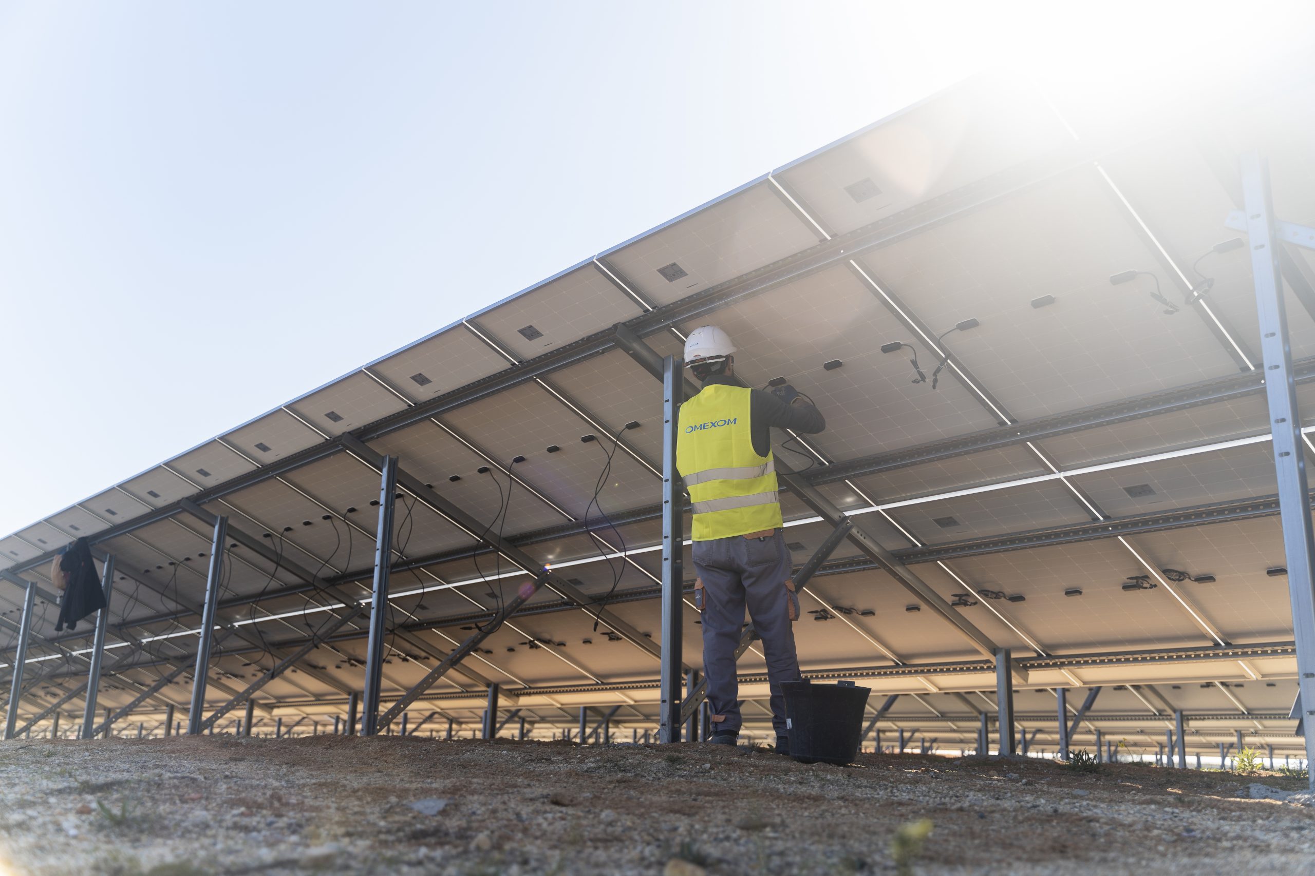 Omexom employee working on a solar panel at Faro solar farm