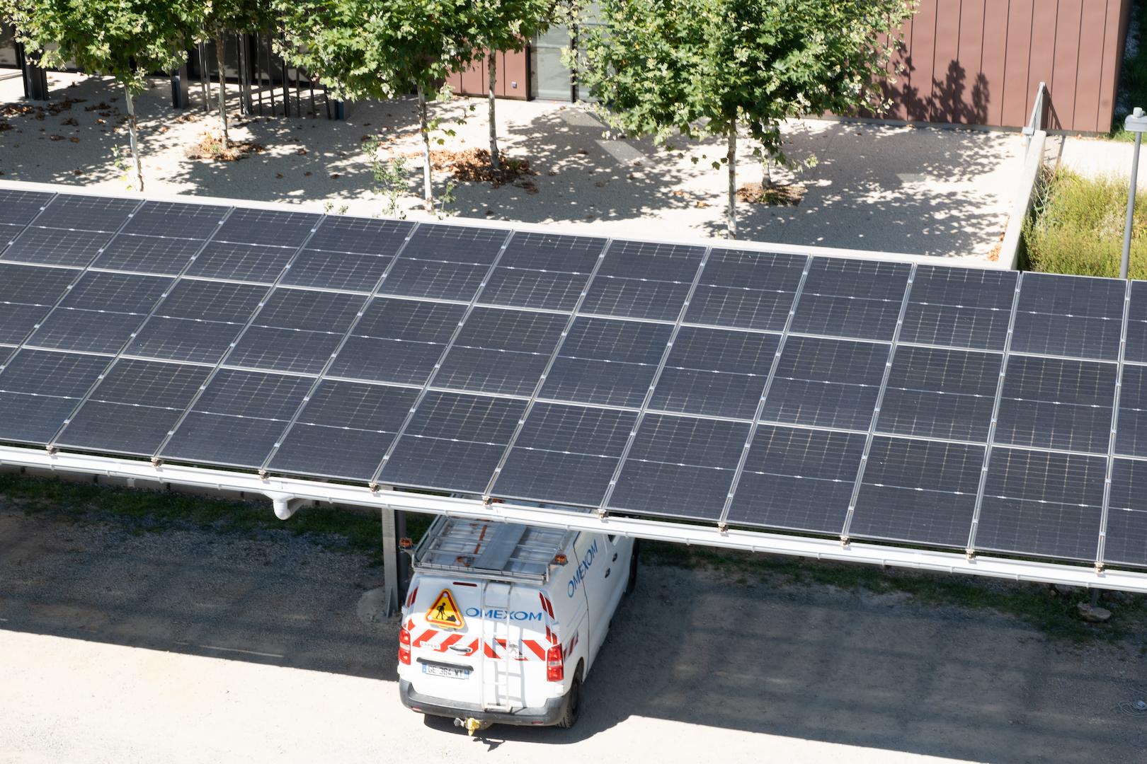Solar car park canopy with rooftop photovoltaic panels generating renewable electricity