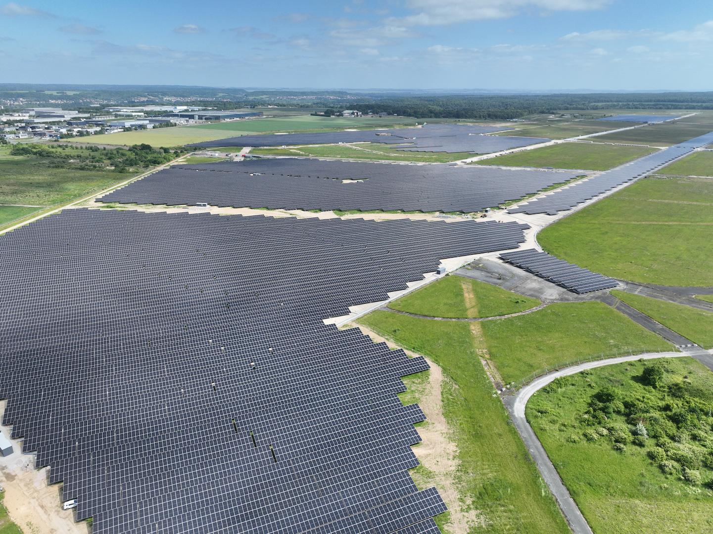 Ground-mounted photovoltaic solar installation with access roads and infrastructure