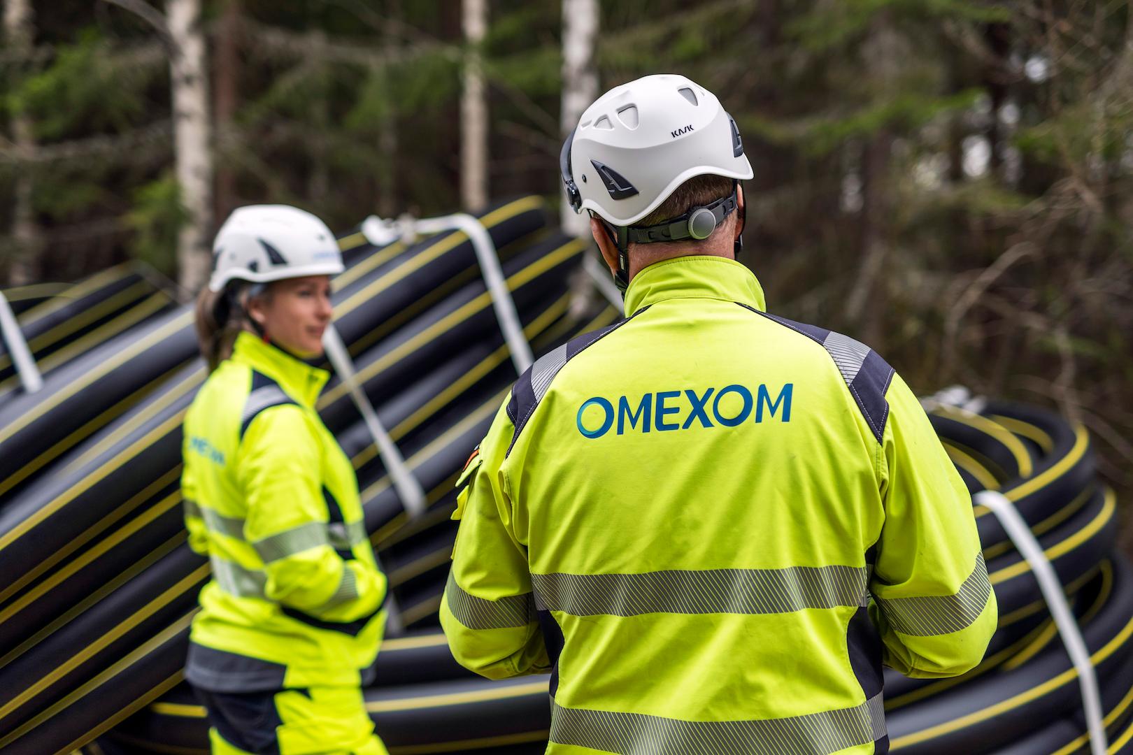 Omexom technicians managing underground power distribution cables to reduce environmental impact in Sweden