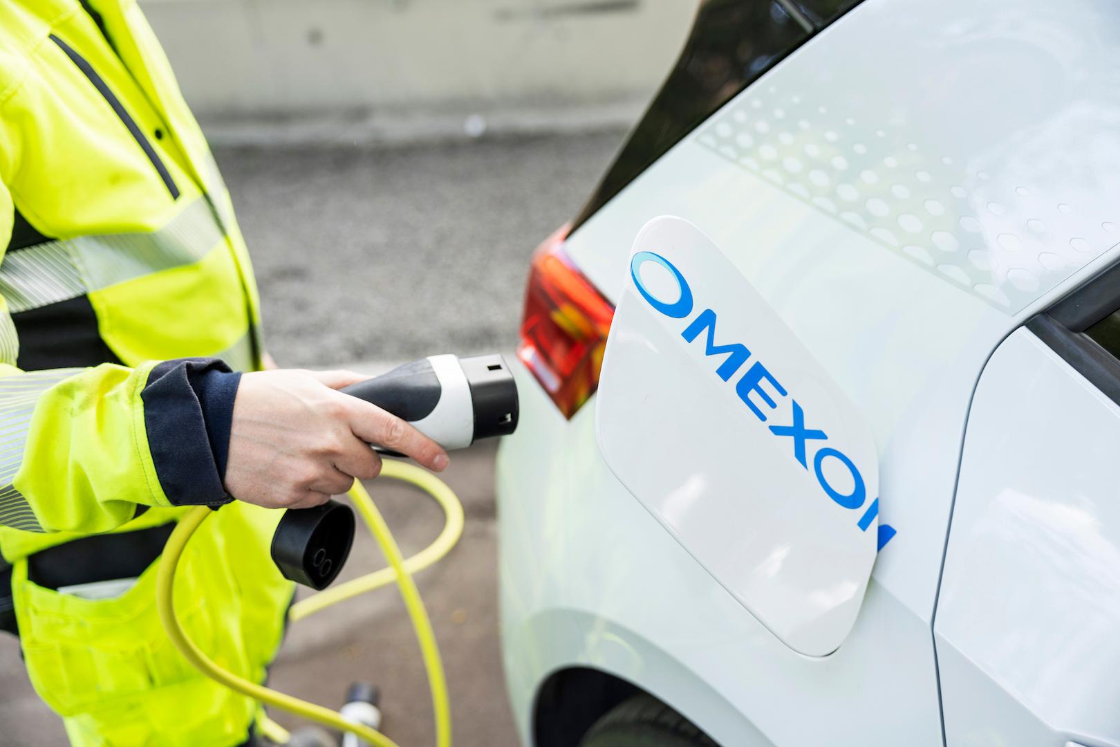 Electric vehicle charging using Omexom-branded infrastructure promoting e-mobility and low-carbon transport