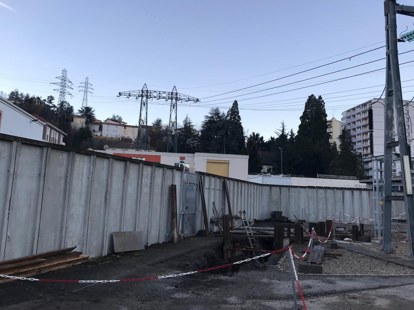 Long underground trench with installed conduits and formwork for highvoltage transmission cable installation