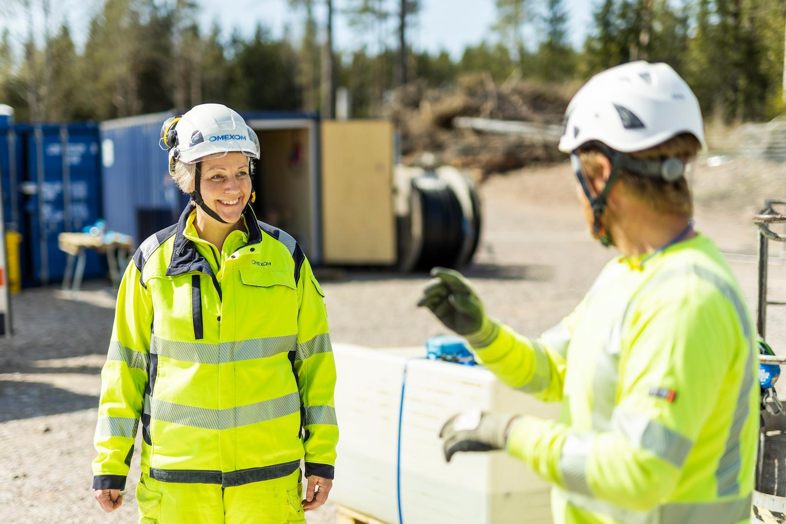 Technicians working at a transformer station using sustainable materials to support low-impact electricity distribution