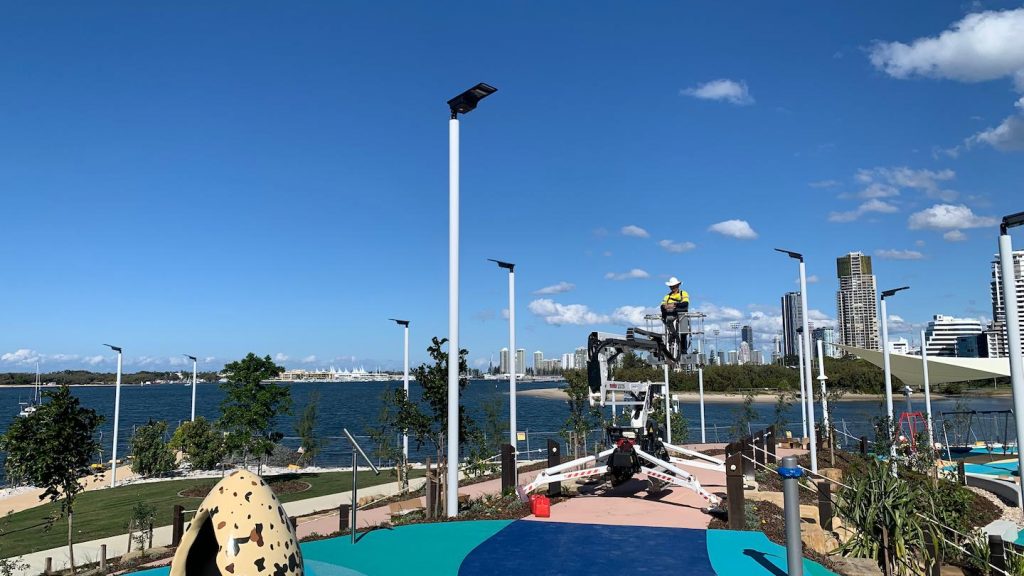 Waterfront urban park with modern LED lighting poles, enhancing safety and visibility in public recreational spaces