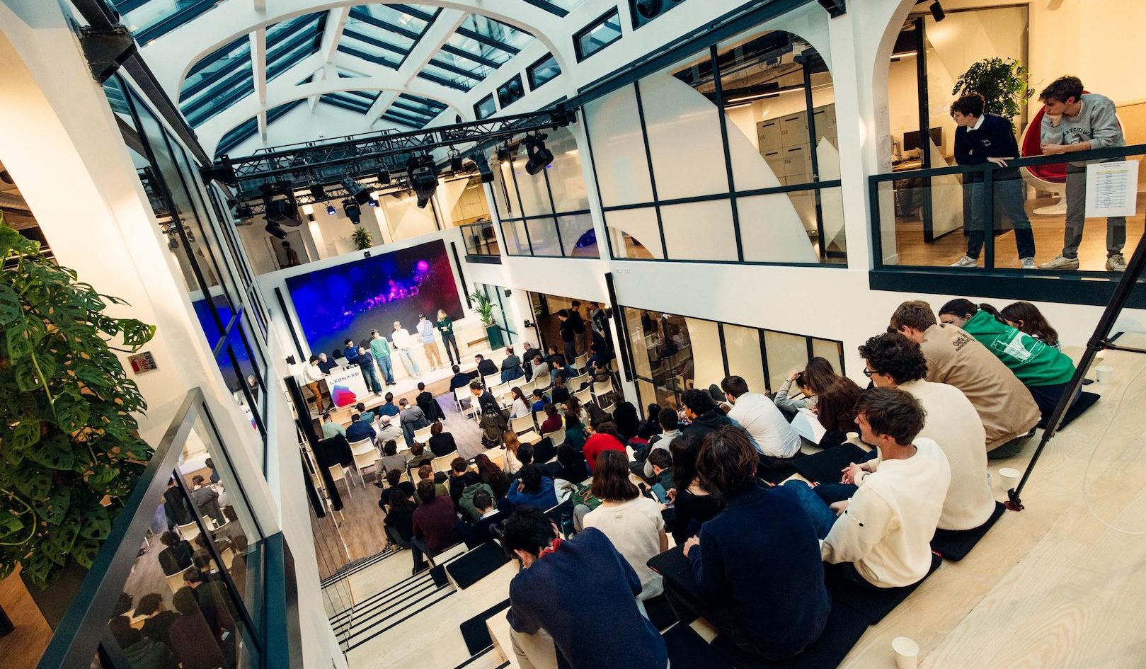 Audience attending a technology innovation conference focused on energy transition and digital infrastructure in a modern venue