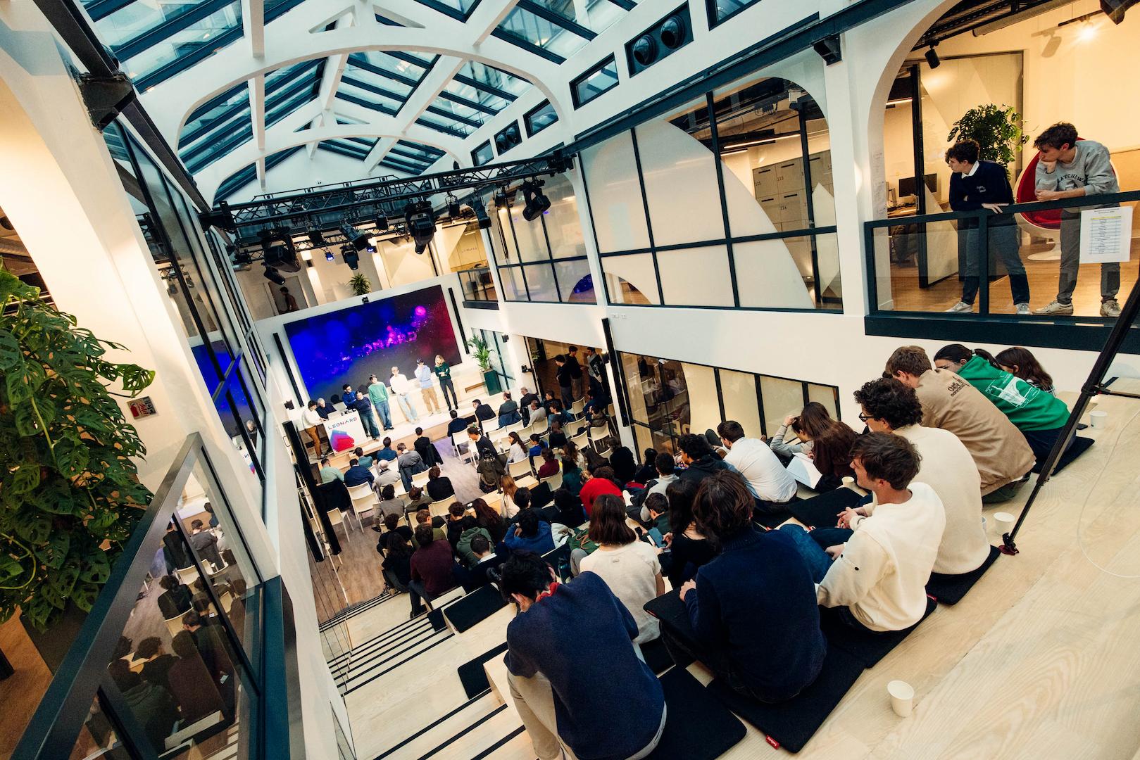 Audience attending a technology innovation conference focused on energy transition and digital infrastructure in a modern venue