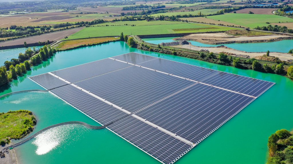 Aerial view of the full floating solar array and access platform at the Saint-Élix-le-Château hybrid solar power plant in southwestern France.