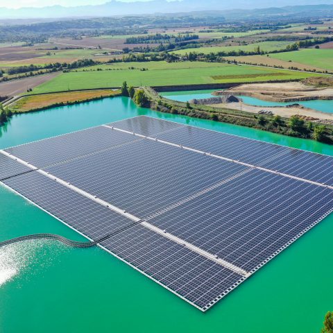 Aerial view of the full floating solar array and access platform at the Saint-Élix-le-Château hybrid solar power plant in southwestern France.